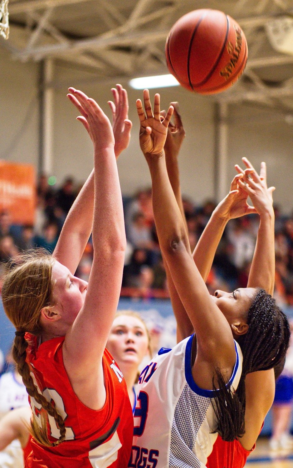 Mineola's Macy Fischer thwarts the shot of Quitman's Allie Berry. [more hoops highlights here]